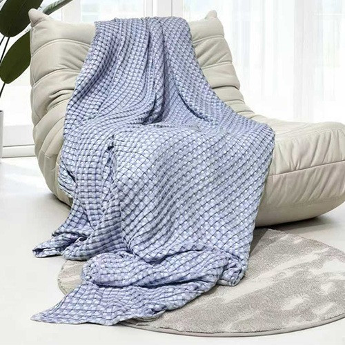 Bambi All Seasons Cotton Bamboo Lightweight Waffle Blanket styled on lounge