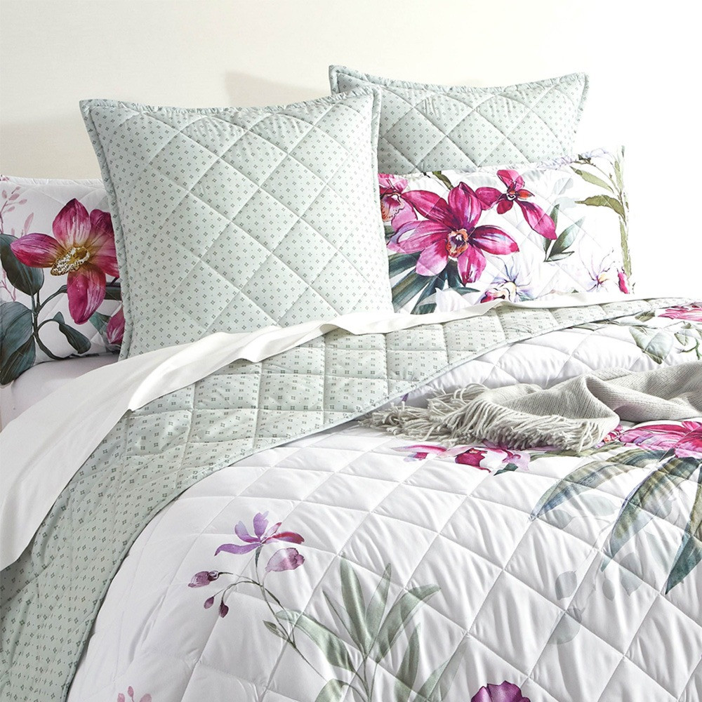 Romantic floral pattern of soft purples, pinks, and lush green foliage