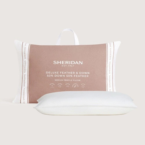 Sheridan pillow styled on bed
