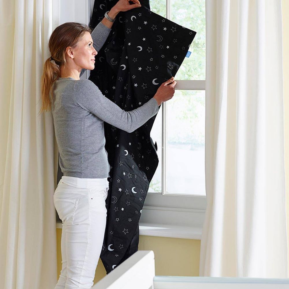 Gro Anywhere Portable Window Blockout Blind Putting out the Blind